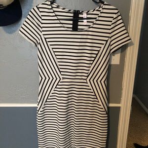 Knee length fitted white and black striped dress